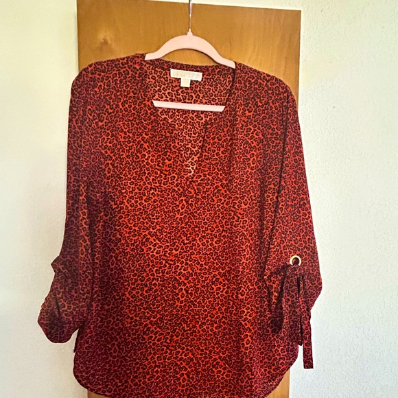 Michael Kors orange and black leopard print shirt. - Picture 1 of 4